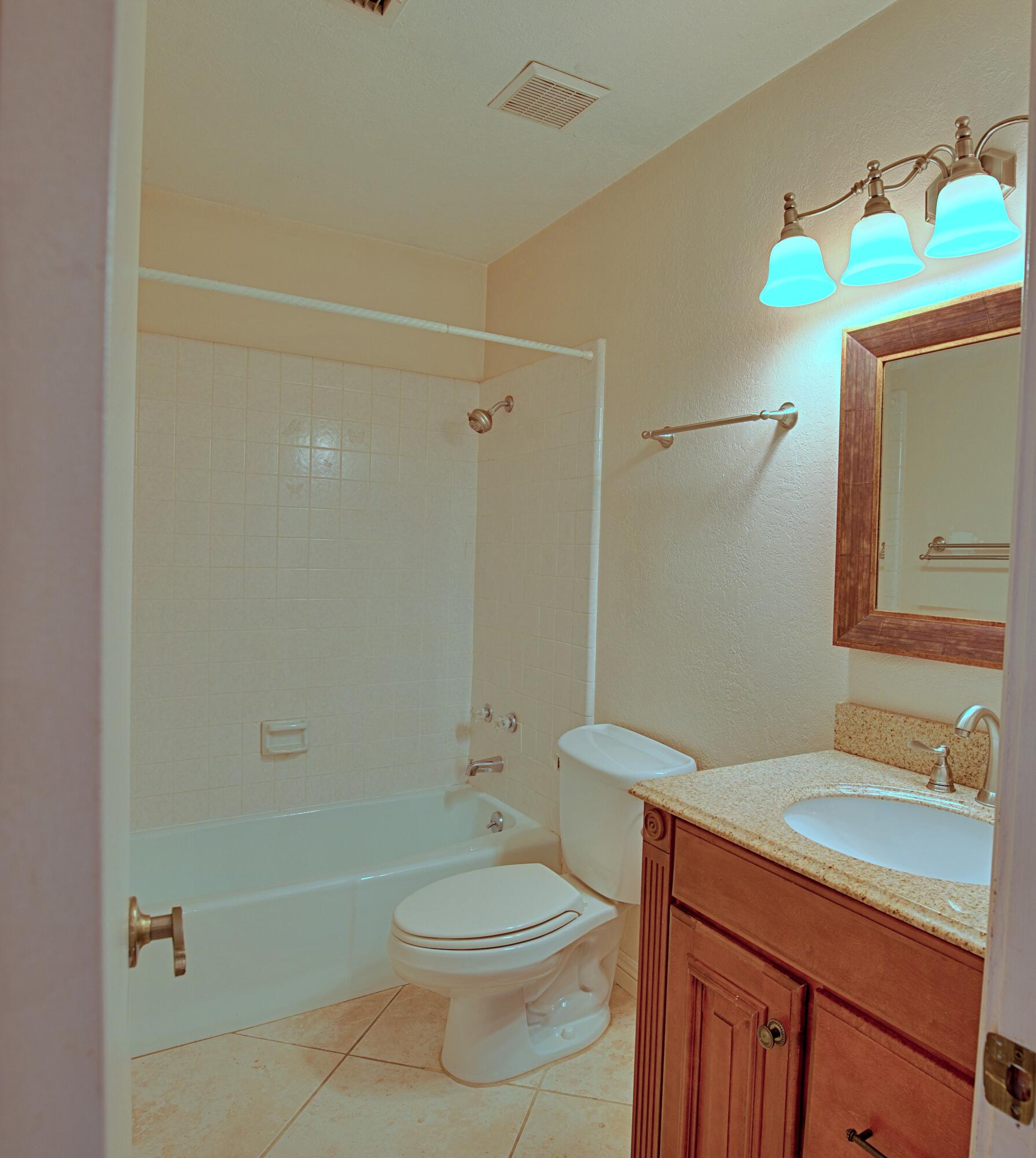80025 Kingston Drive Bermuda Dunes, CA 92203 - Photo 12 of 27 a bathroom with a sink a toilet and shower