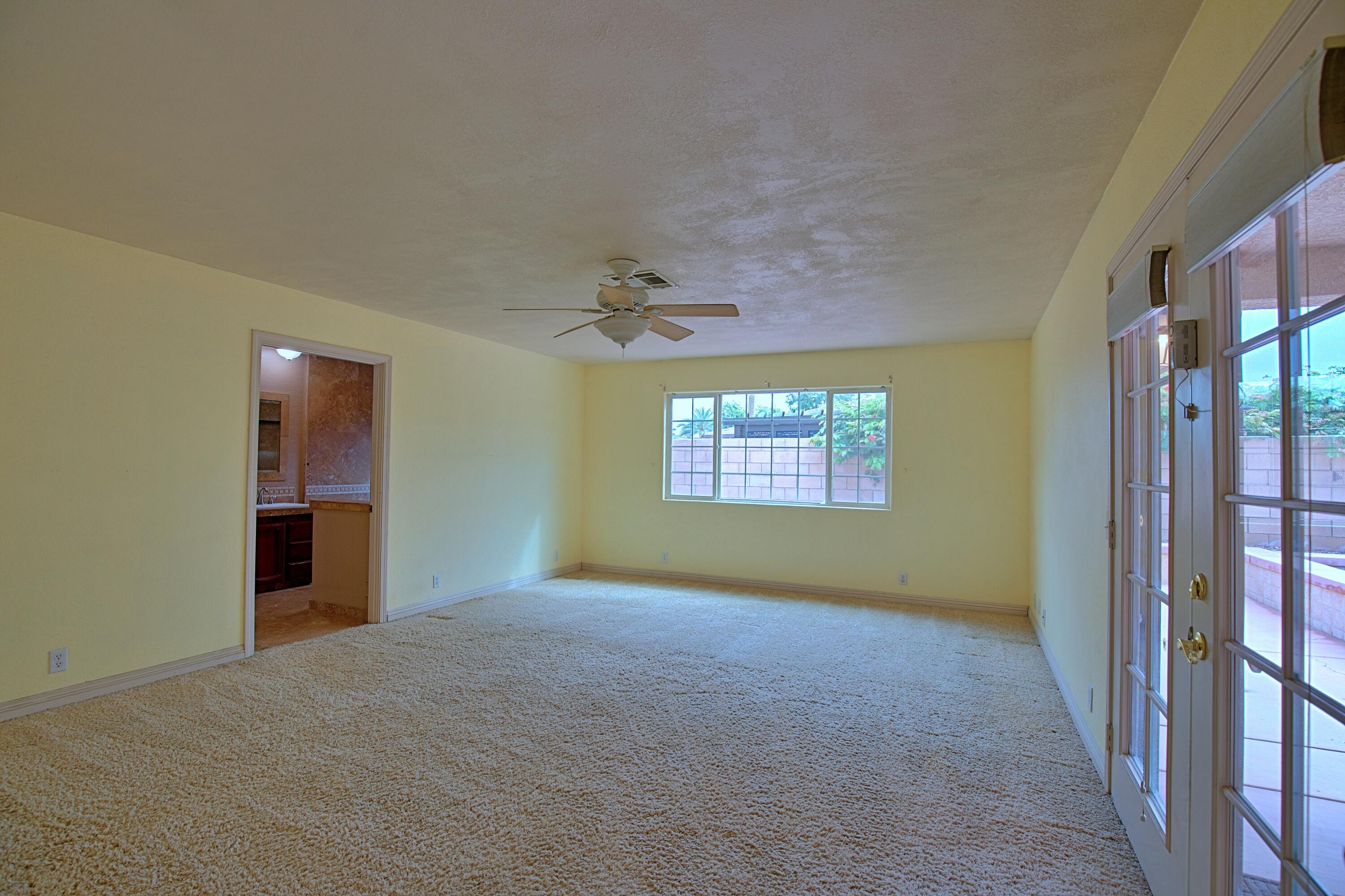 80025 Kingston Drive Bermuda Dunes, CA 92203 - Photo 15 of 27 an empty room with a empty space and windows