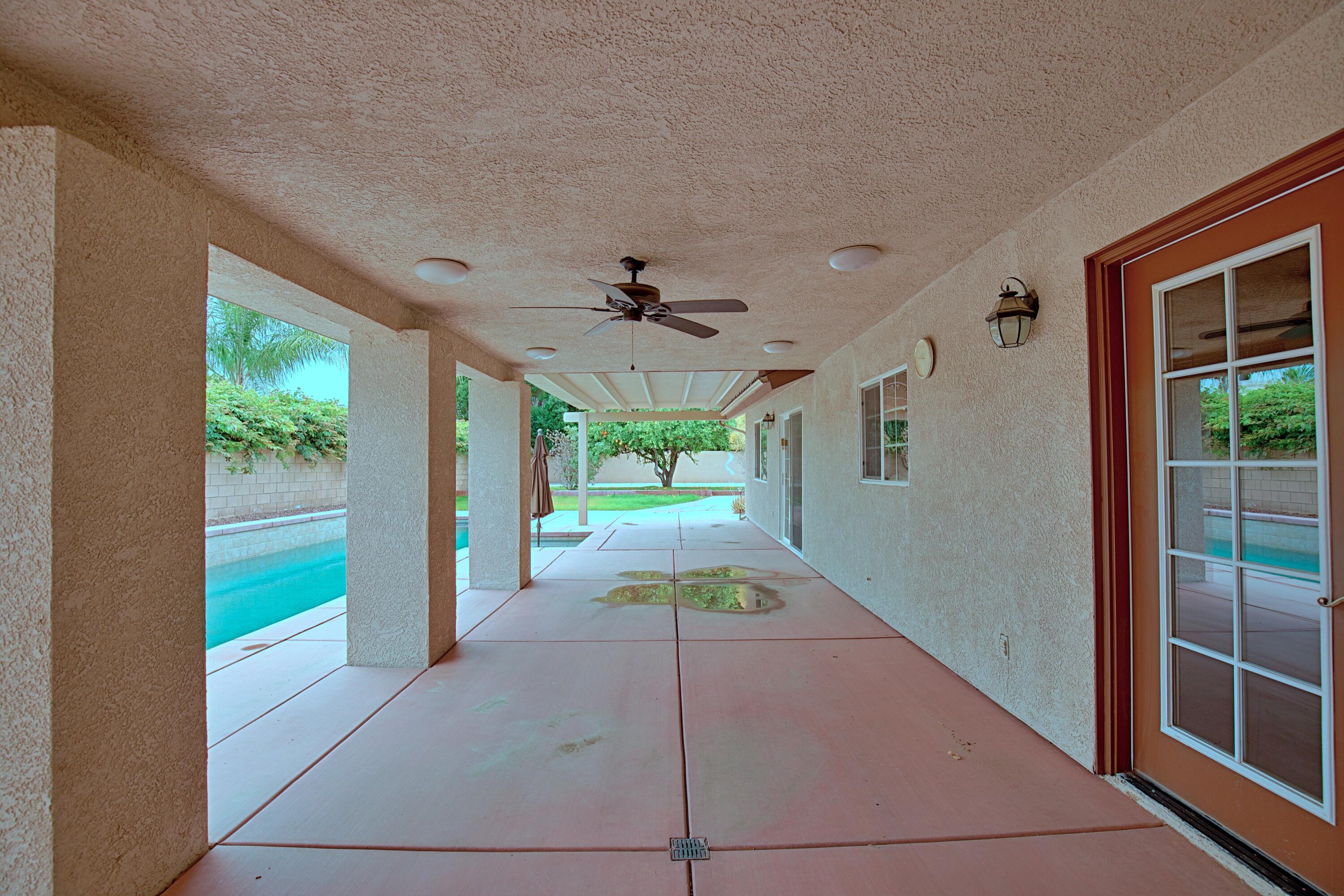 80025 Kingston Drive Bermuda Dunes, CA 92203 - Photo 18 of 27 a view of a porch and garden