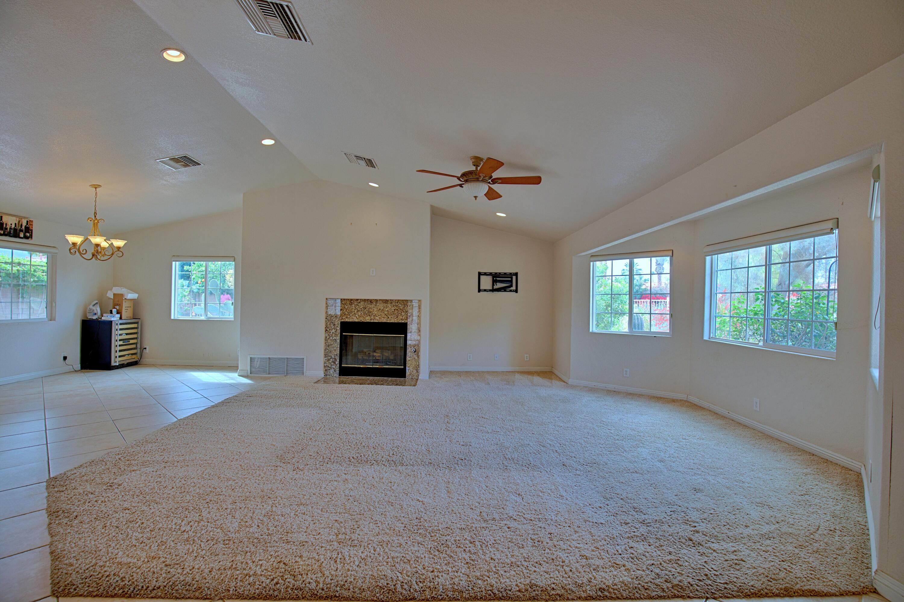 80025 Kingston Drive Bermuda Dunes, CA 92203 - Photo 3 of 27 a view of an empty room with a window and fireplace