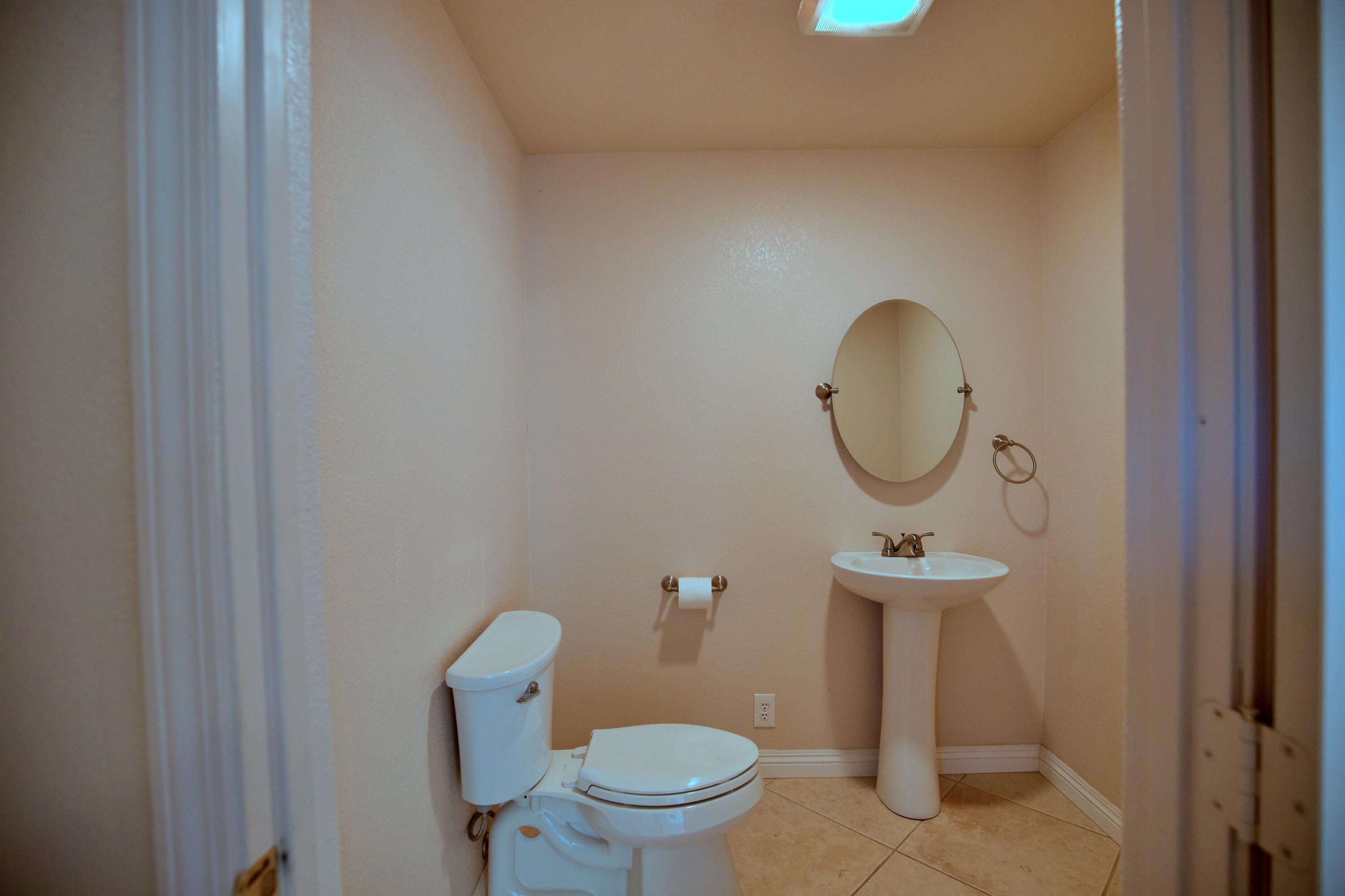 80025 Kingston Drive Bermuda Dunes, CA 92203 - Photo 5 of 27 a bathroom with a toilet and a mirror