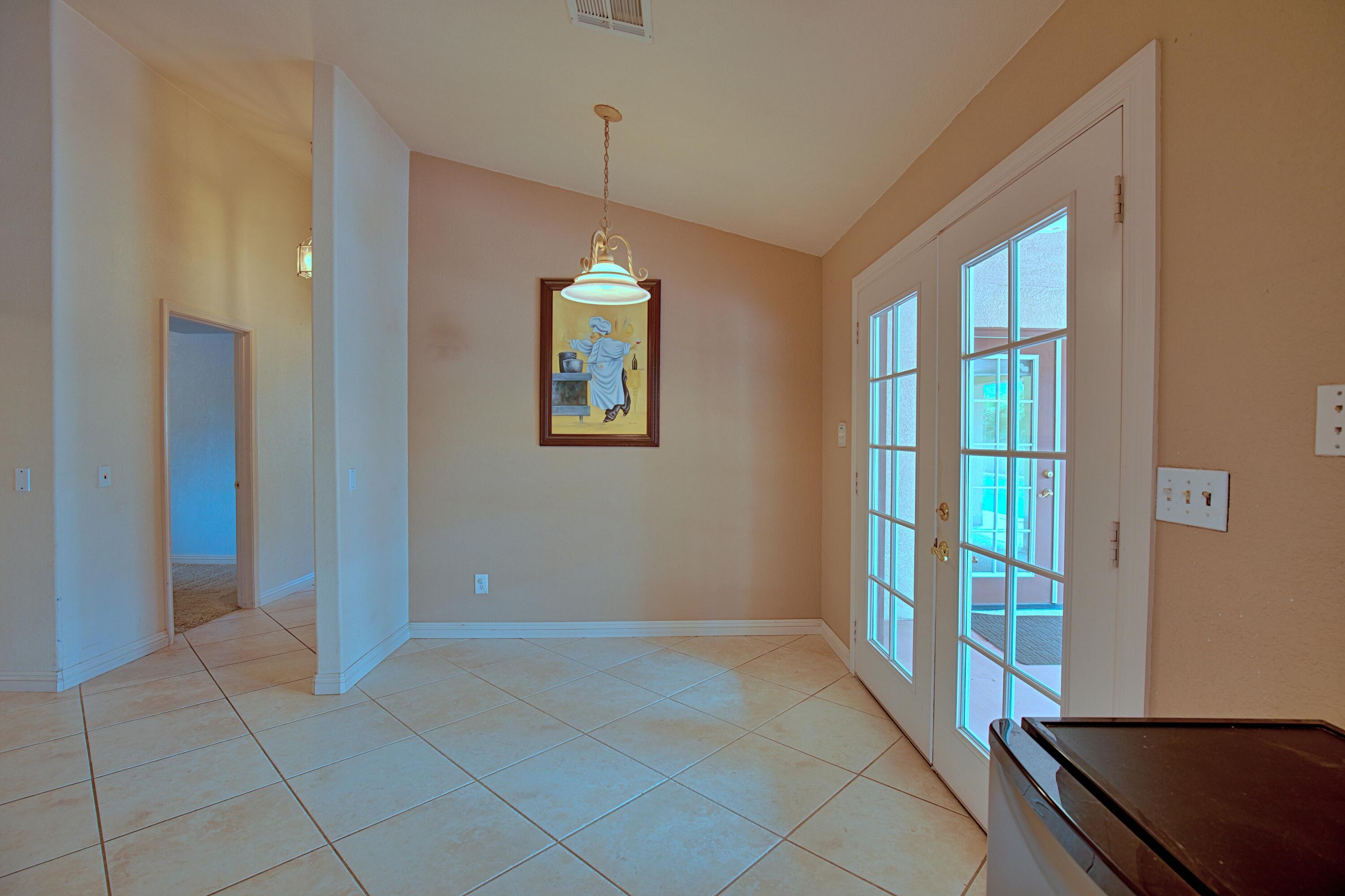 80025 Kingston Drive Bermuda Dunes, CA 92203 - Photo 7 of 27 a view of an empty room with window and wooden floor