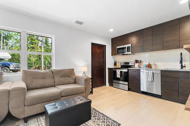a living room with furniture and a window