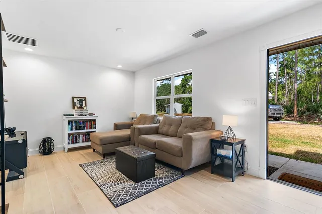 a living room with furniture and a window