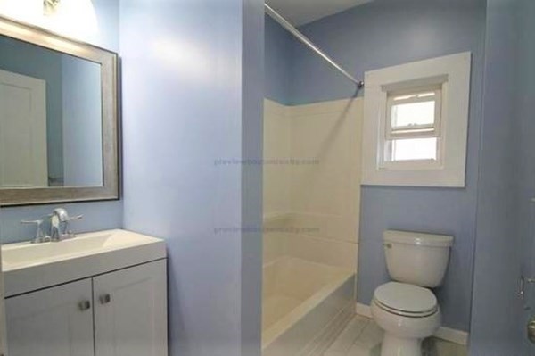 32 Mansfield Street Boston, MA 02134 - Photo 19 of 20 a bathroom with a toilet sink and mirror