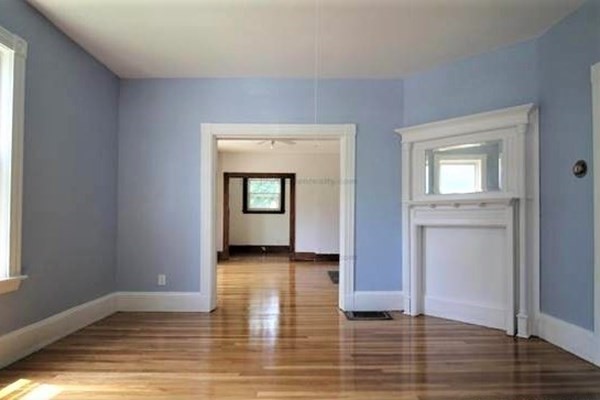 32 Mansfield Street Boston, MA 02134 - Photo 3 of 20 a view of an empty room with window and wooden floor