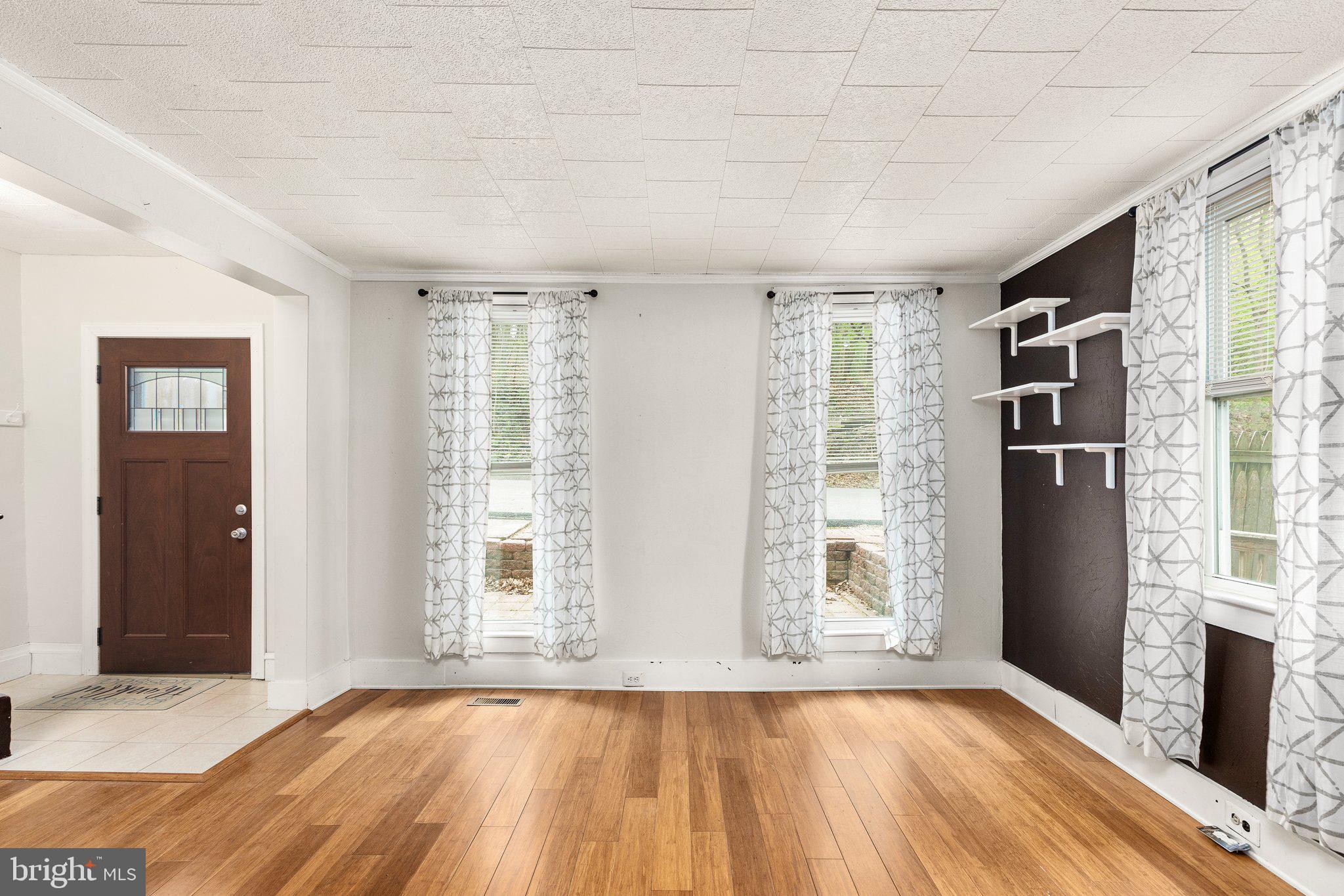 CERAMIC TILE FOYER LEADING TO LIVING ROOM !!