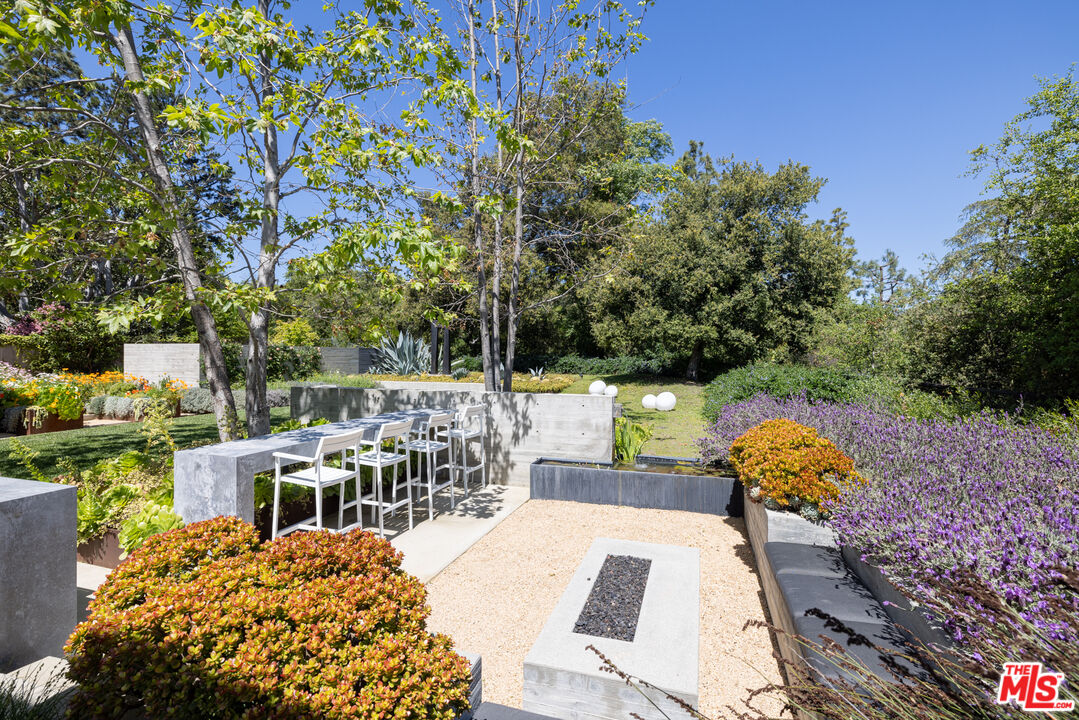 12251 Castlegate Drive Los Angeles, CA 90049 - Photo 19 of 30 a view of a patio with wooden floor