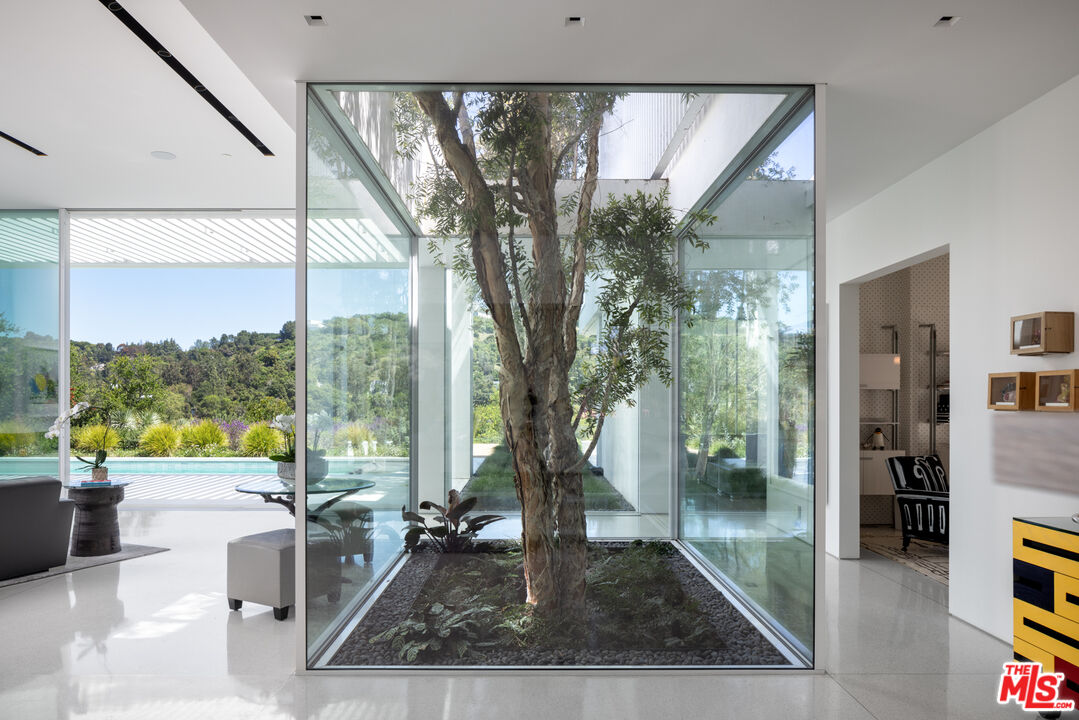 12251 Castlegate Drive Los Angeles, CA 90049 - Photo 9 of 30 a very nice looking living room with a large window