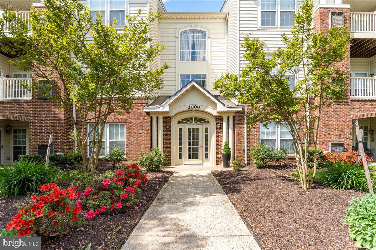 2000 Connor Court, Unit 705C Bowie, MD 20721 - Photo 1 of 28 a front view of a house with a garden