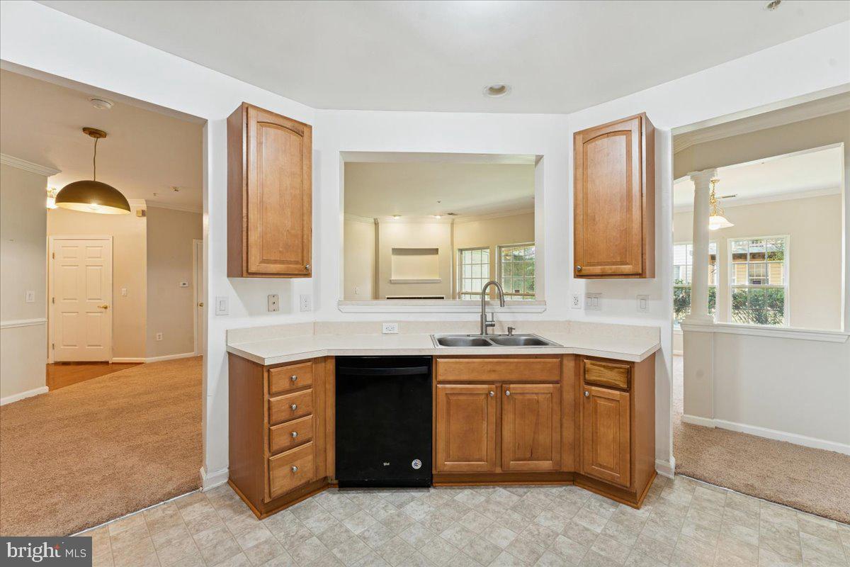 2000 Connor Court, Unit 705C Bowie, MD 20721 - Photo 12 of 28 a kitchen with a sink and cabinets