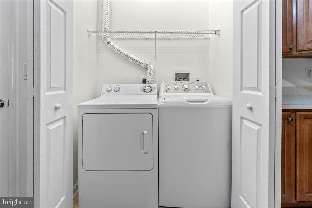 2000 Connor Court, Unit 705C Bowie, MD 20721 - Photo 14 of 28 a utility room with dryer and washer