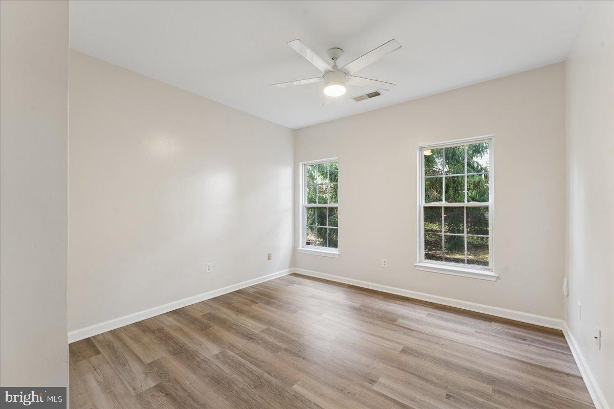 2000 Connor Court, Unit 705C Bowie, MD 20721 - Photo 15 of 28 a view of an empty room with wooden floor and window