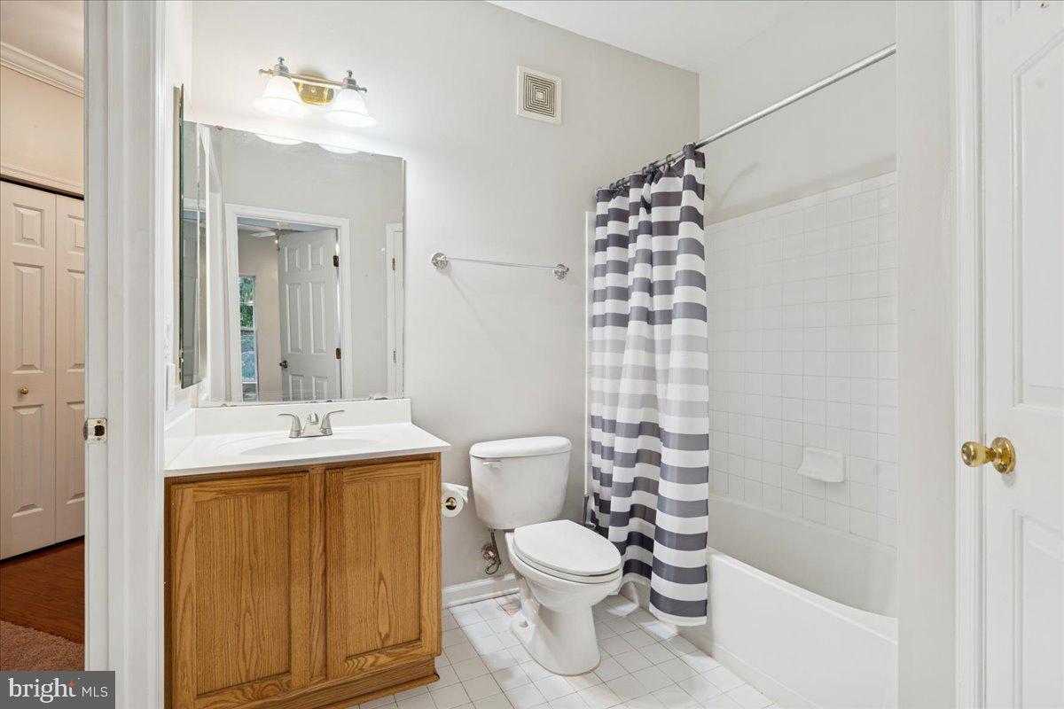 2000 Connor Court, Unit 705C Bowie, MD 20721 - Photo 17 of 28 a bathroom with a sink a toilet and shower