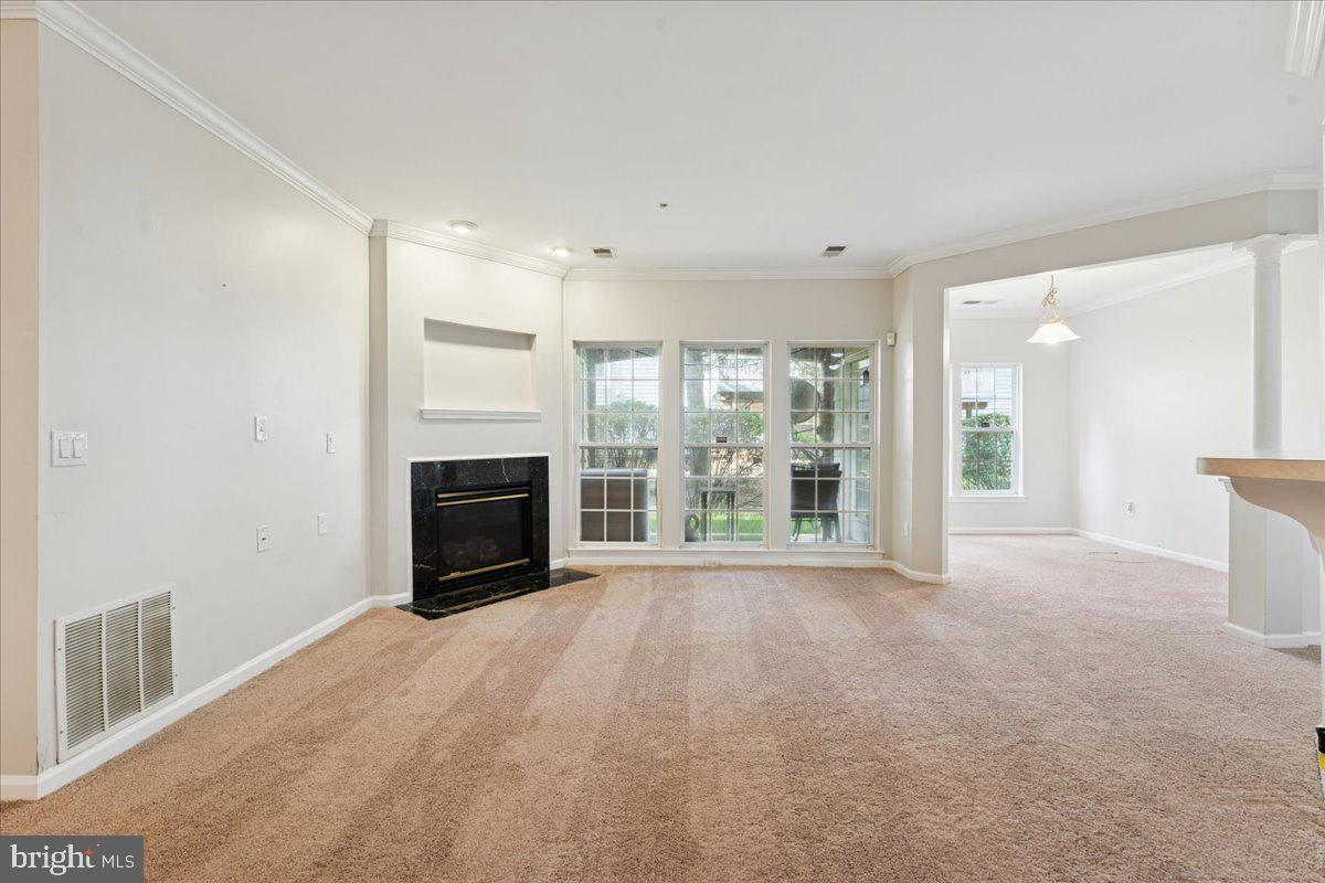 2000 Connor Court, Unit 705C Bowie, MD 20721 - Photo 3 of 28 a view of empty room with a fireplace