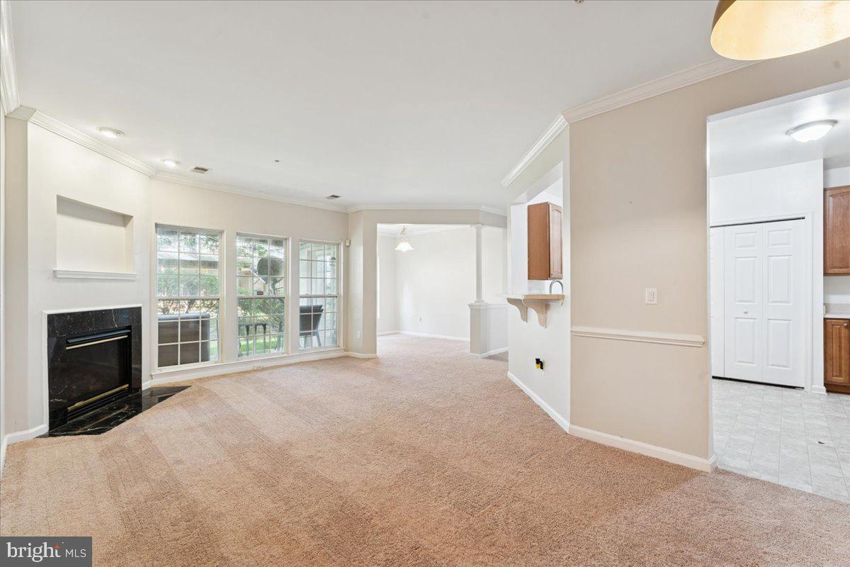 2000 Connor Court, Unit 705C Bowie, MD 20721 - Photo 4 of 28 a view of an empty room with a fireplace and a window