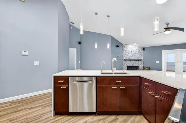 a kitchen with a sink and cabinets