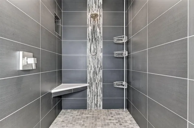 a bathroom with a walk in closet and a window