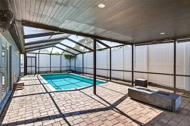 a room with a bed and a chandelier