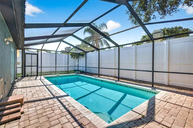 an aerial view of multiple houses with yard