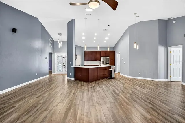 a view of kitchen with a sink and a large window