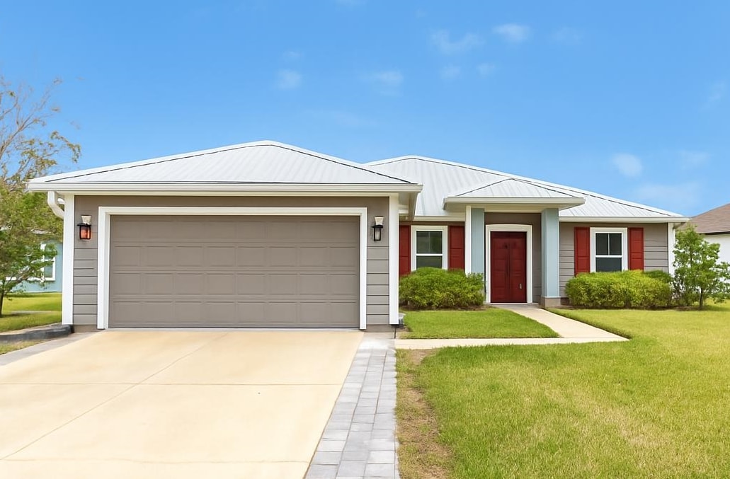 a front view of house with yard and green space