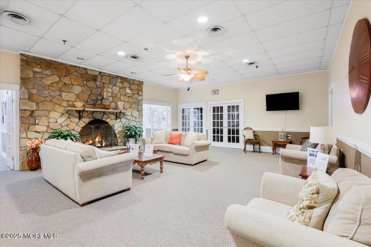 12 Lamb Road Brick, NJ 08724 - Photo 33 of 43 a living room with furniture and a flat screen tv