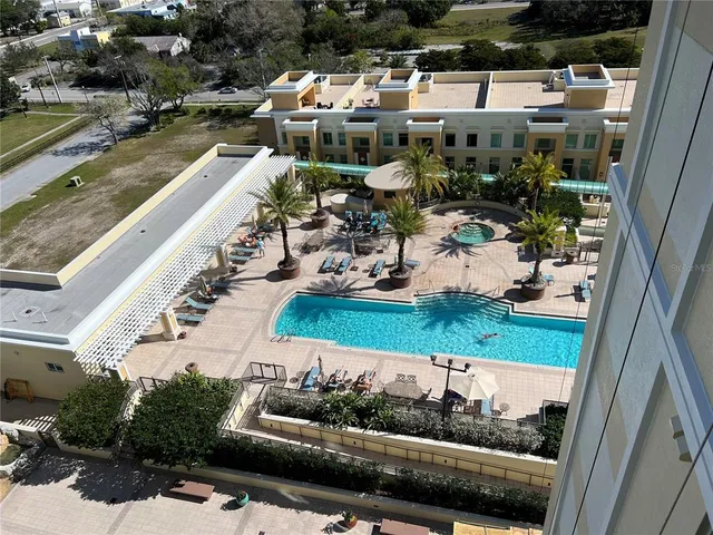 a view of cars parked on the side of a street
