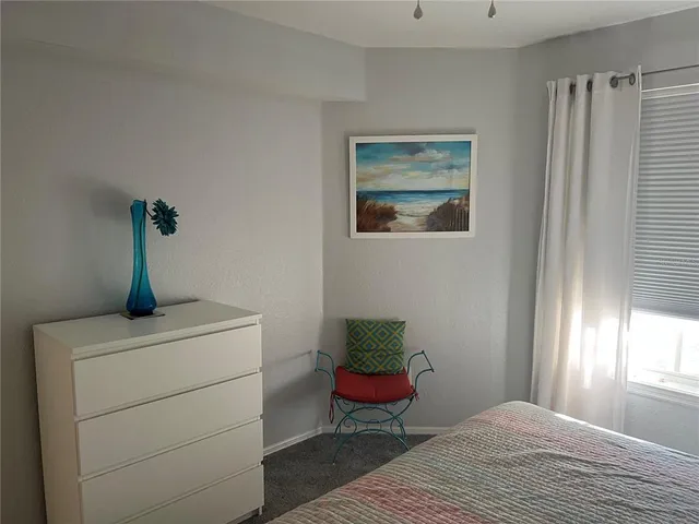 a room with a door and a rug