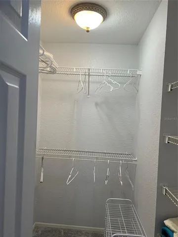 a bathroom with a granite countertop toilet a sink and a bathtub