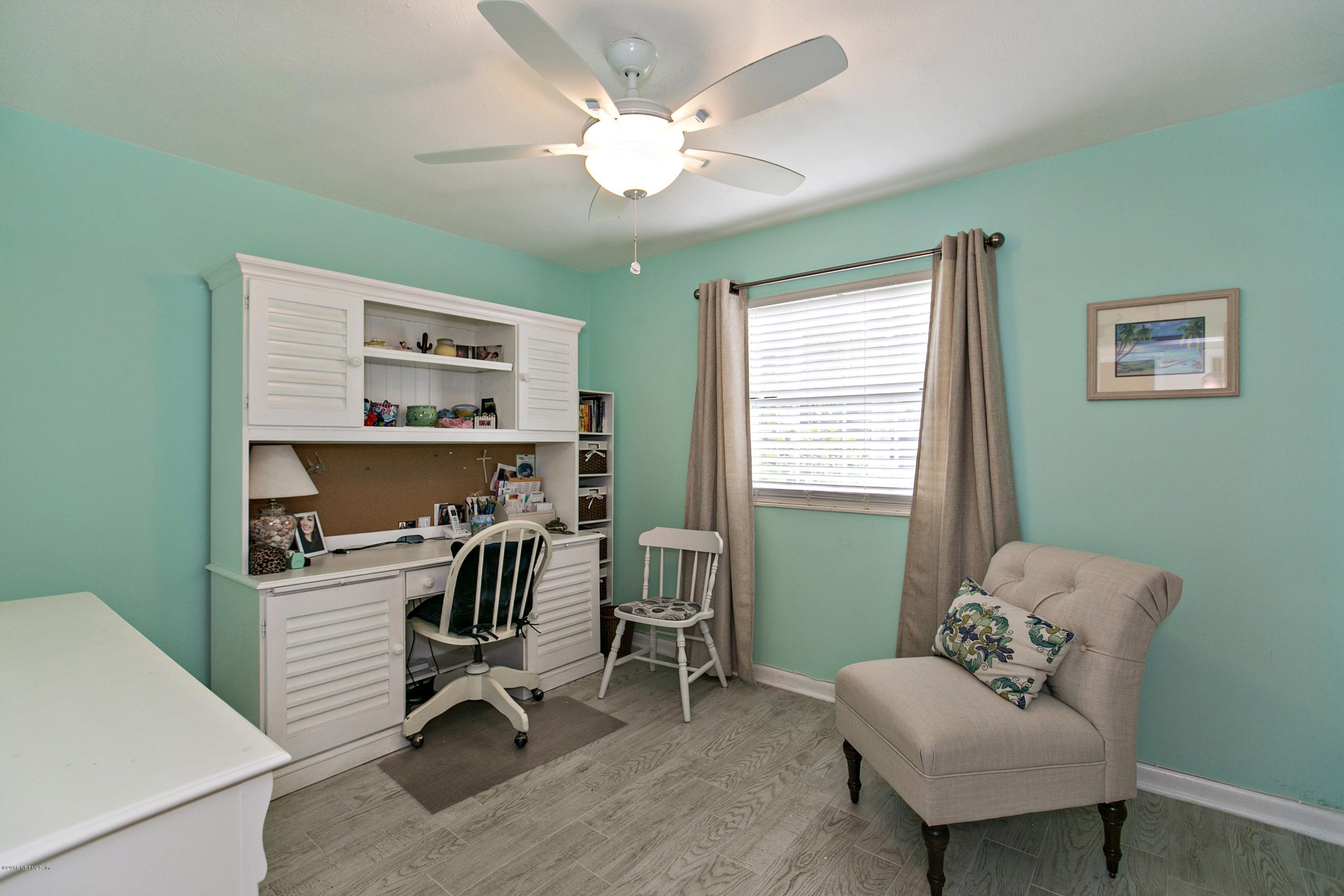 4034 Eunice Road Jacksonville, FL 32250 - Photo 16 of 24 a view of a workspace with furniture and a window