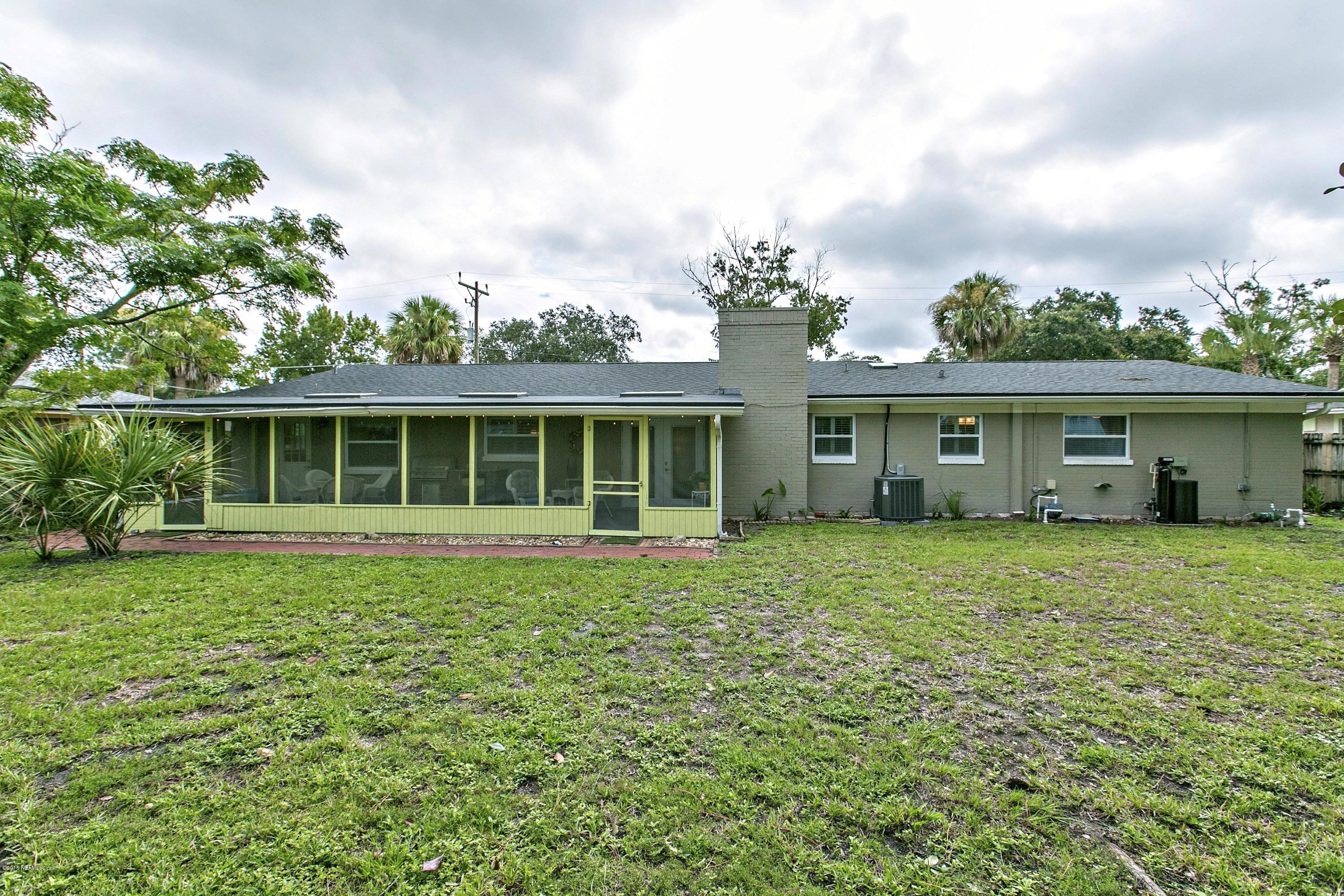 4034 Eunice Road Jacksonville, FL 32250 - Photo 20 of 24 a front view of a house with a garden