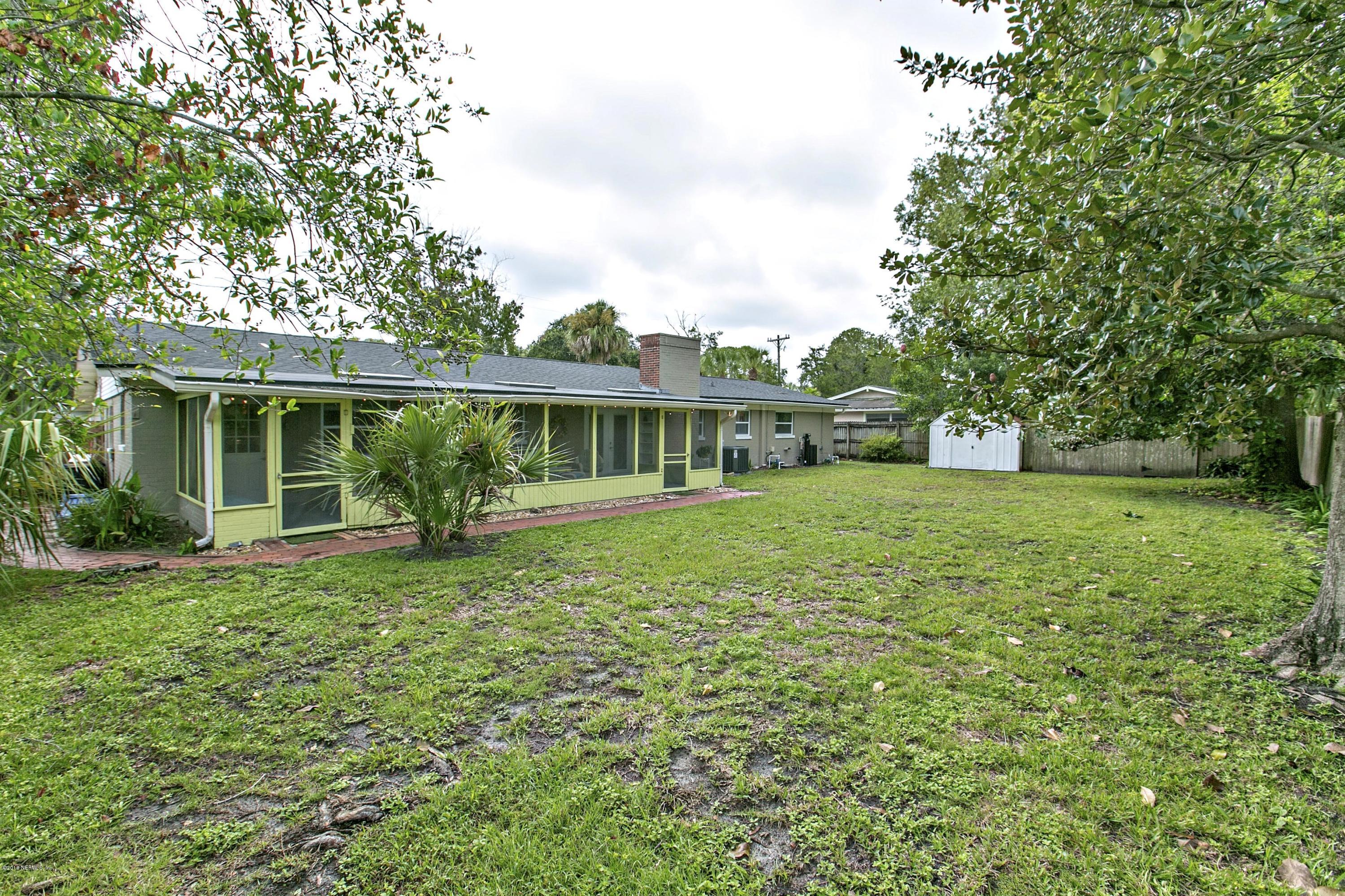 4034 Eunice Road Jacksonville, FL 32250 - Photo 21 of 24 a front view of a house with a yard
