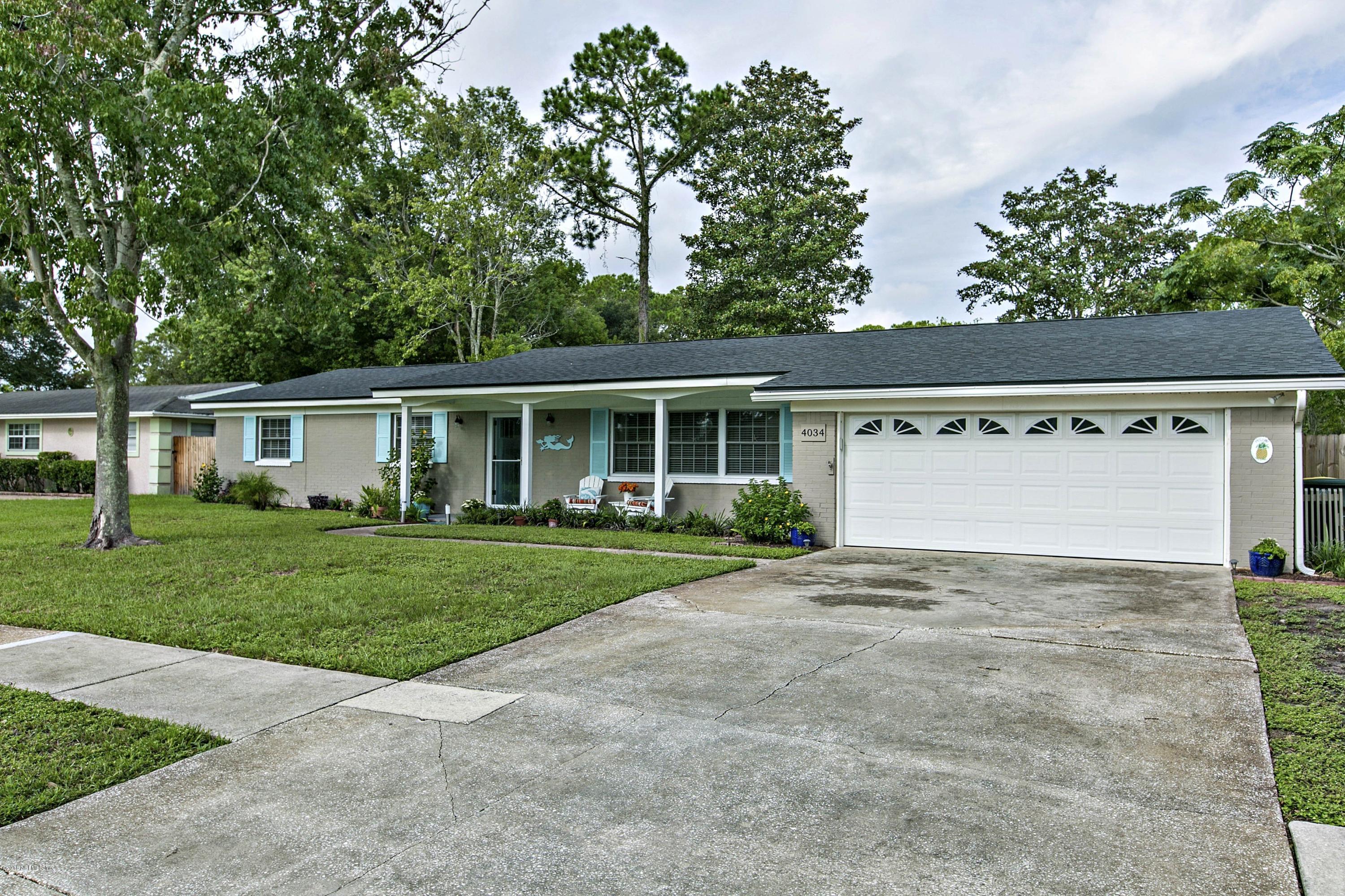 4034 Eunice Road Jacksonville, FL 32250 - Photo 24 of 24 front view of a house with a yard and a garage