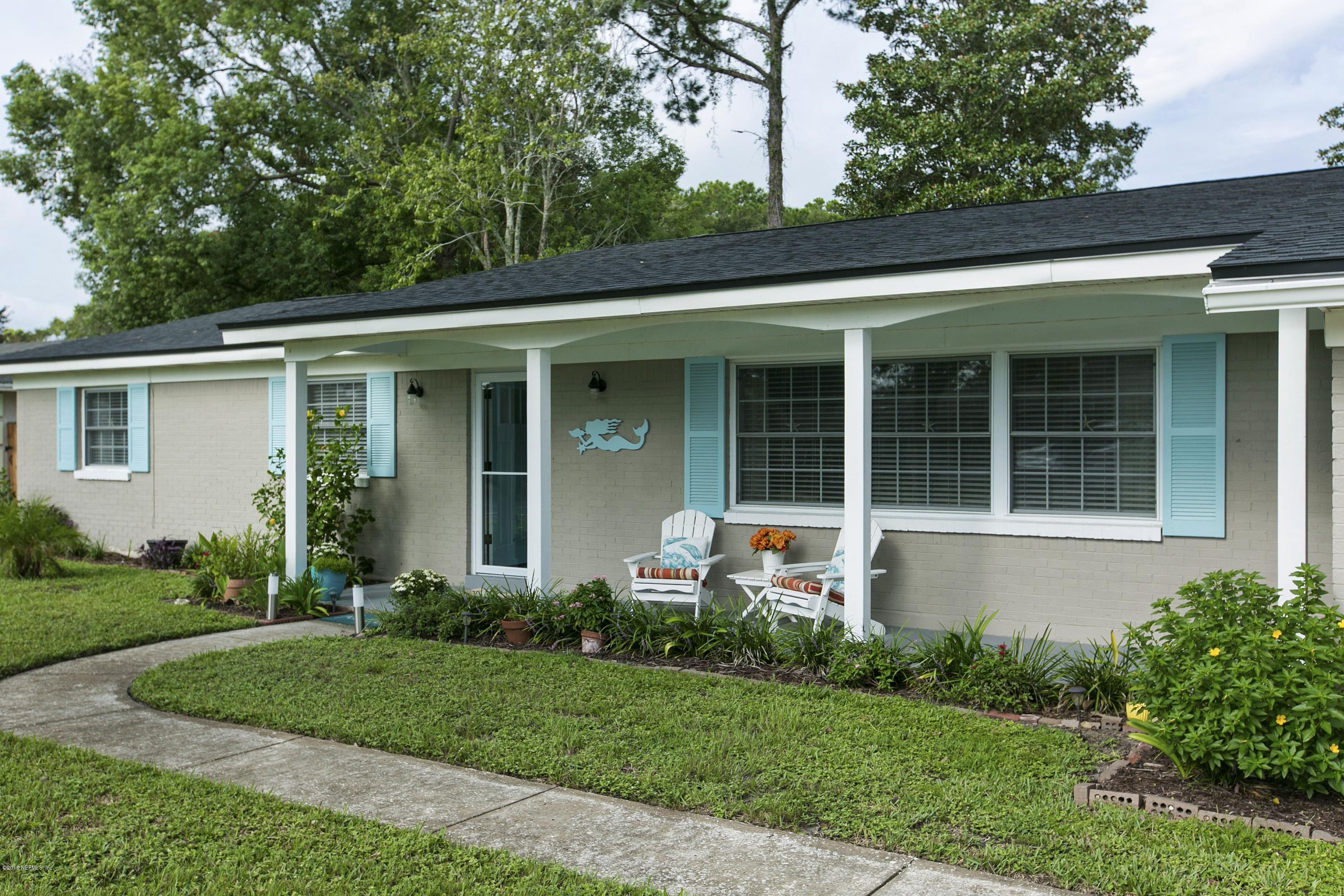 4034 Eunice Road Jacksonville, FL 32250 - Photo 3 of 24 front view of house with a yard