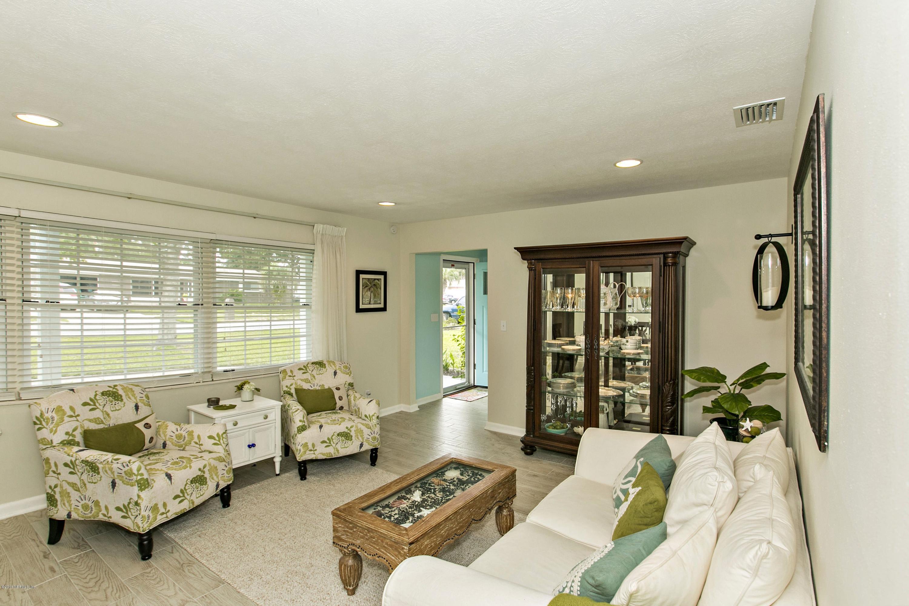 4034 Eunice Road Jacksonville, FL 32250 - Photo 5 of 24 a living room with furniture and a large window