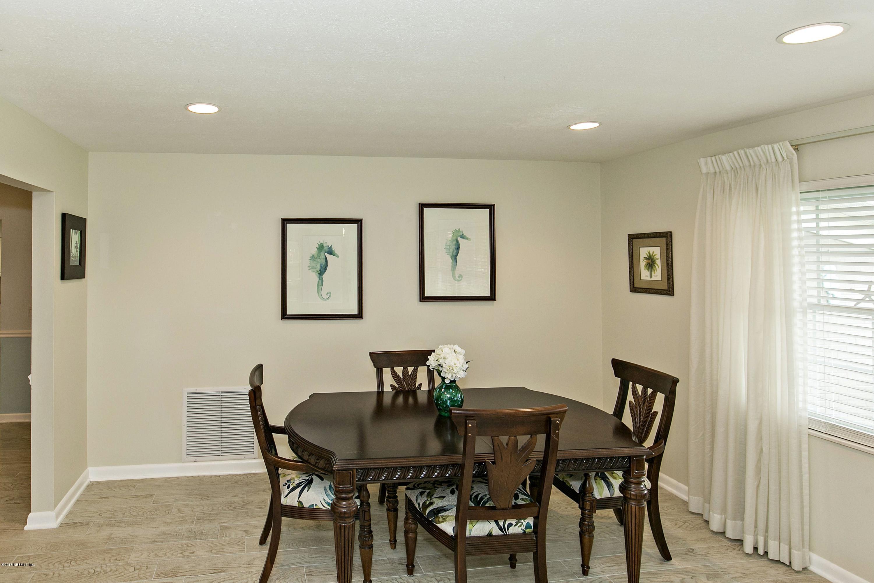 4034 Eunice Road Jacksonville, FL 32250 - Photo 6 of 24 a view of a dining room with furniture and a window