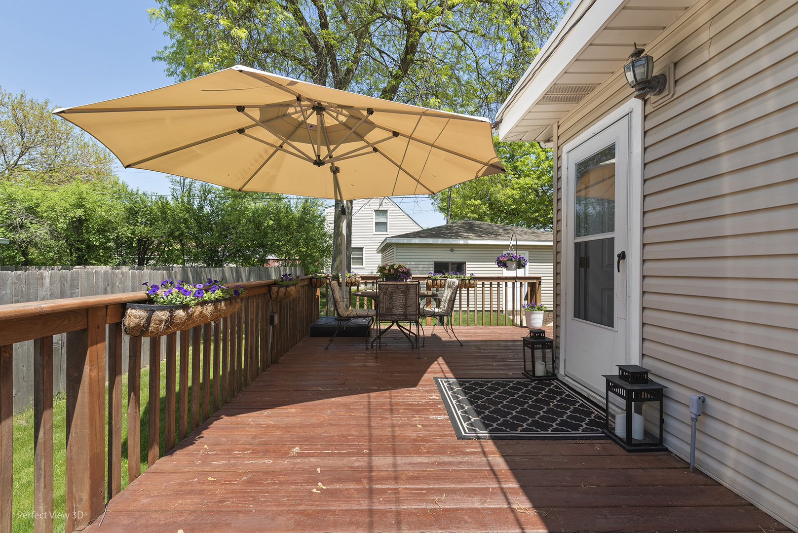 1020 Mitchell Avenue Elmhurst, IL 60126 - Photo 28 of 44 a view of a roof deck with wooden floor and fence