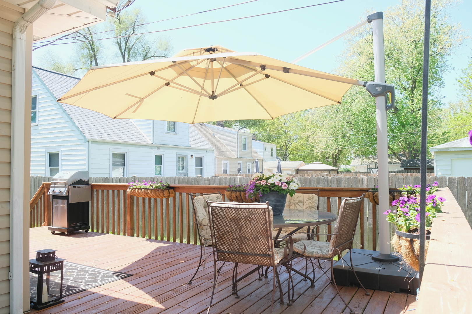 1020 Mitchell Avenue Elmhurst, IL 60126 - Photo 30 of 44 a patio with wooden floor a yard a table and chairs