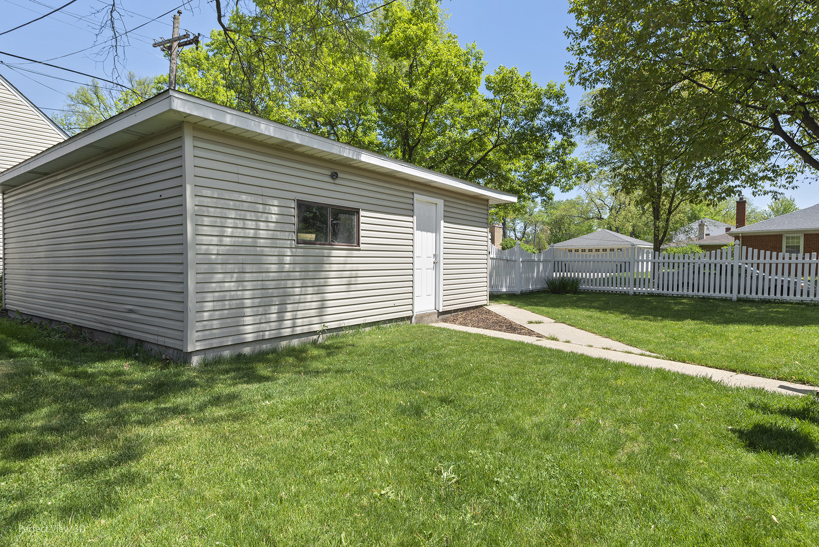 1020 Mitchell Avenue Elmhurst, IL 60126 - Photo 32 of 44 a view of a house with a backyard