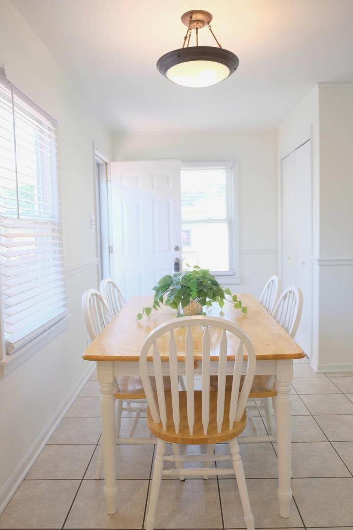 1020 Mitchell Avenue Elmhurst, IL 60126 - Photo 8 of 44 a view of a dining room with furniture and chandelier