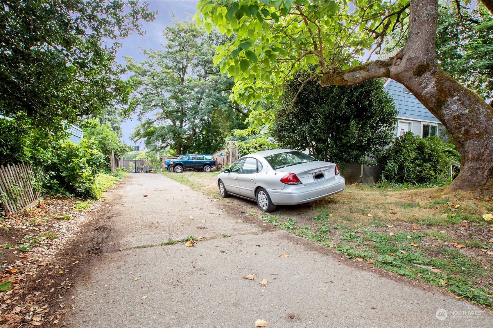 610 Boulevard Road Southeast Olympia, WA 98501 - Photo 5 of 5 a car parked in front of a white house