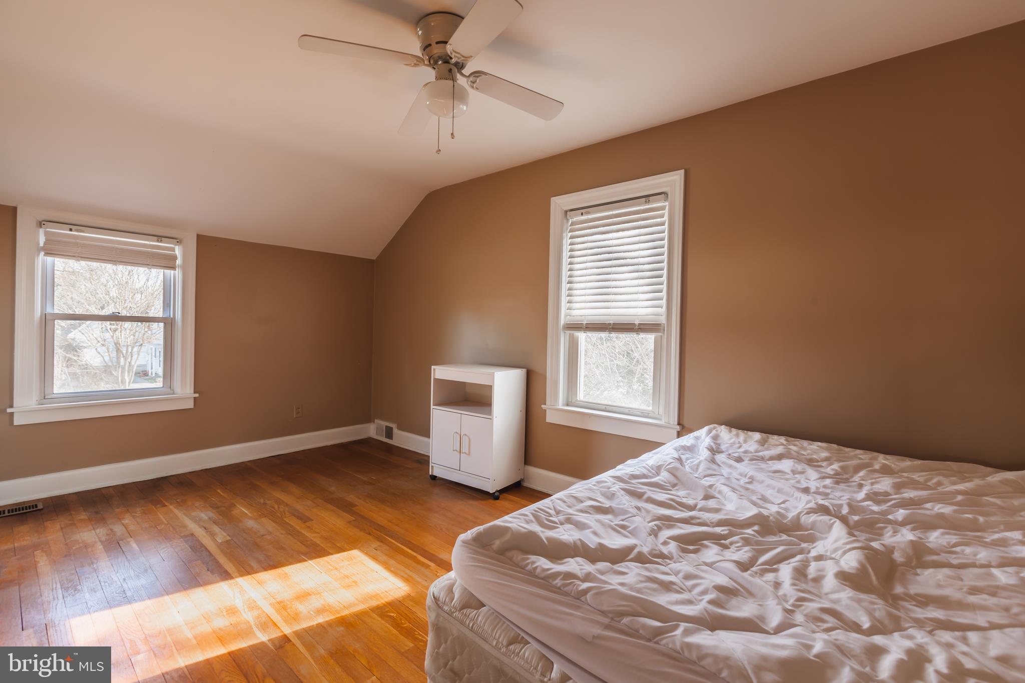 23 Sunset Road Newark, DE 19711 - Photo 14 of 25 a bedroom with a bed and wooden floor