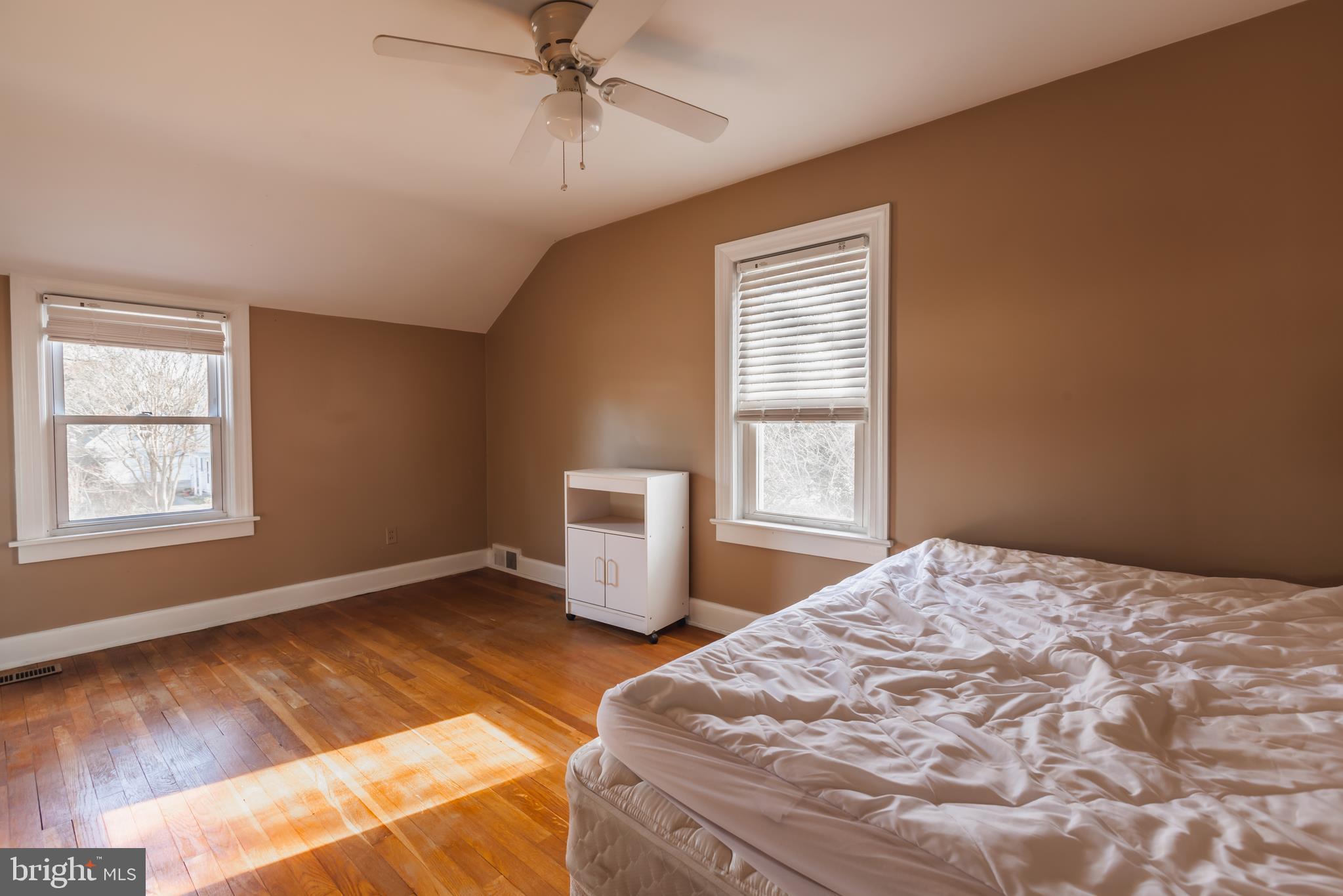 23 Sunset Road Newark, DE 19711 - Photo 15 of 25 a bedroom with a bed and wooden floor