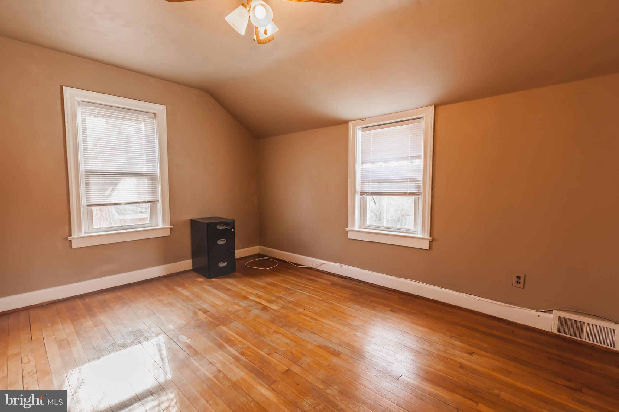 23 Sunset Road Newark, DE 19711 - Photo 16 of 25 a view of an empty room with a window and wooden floor