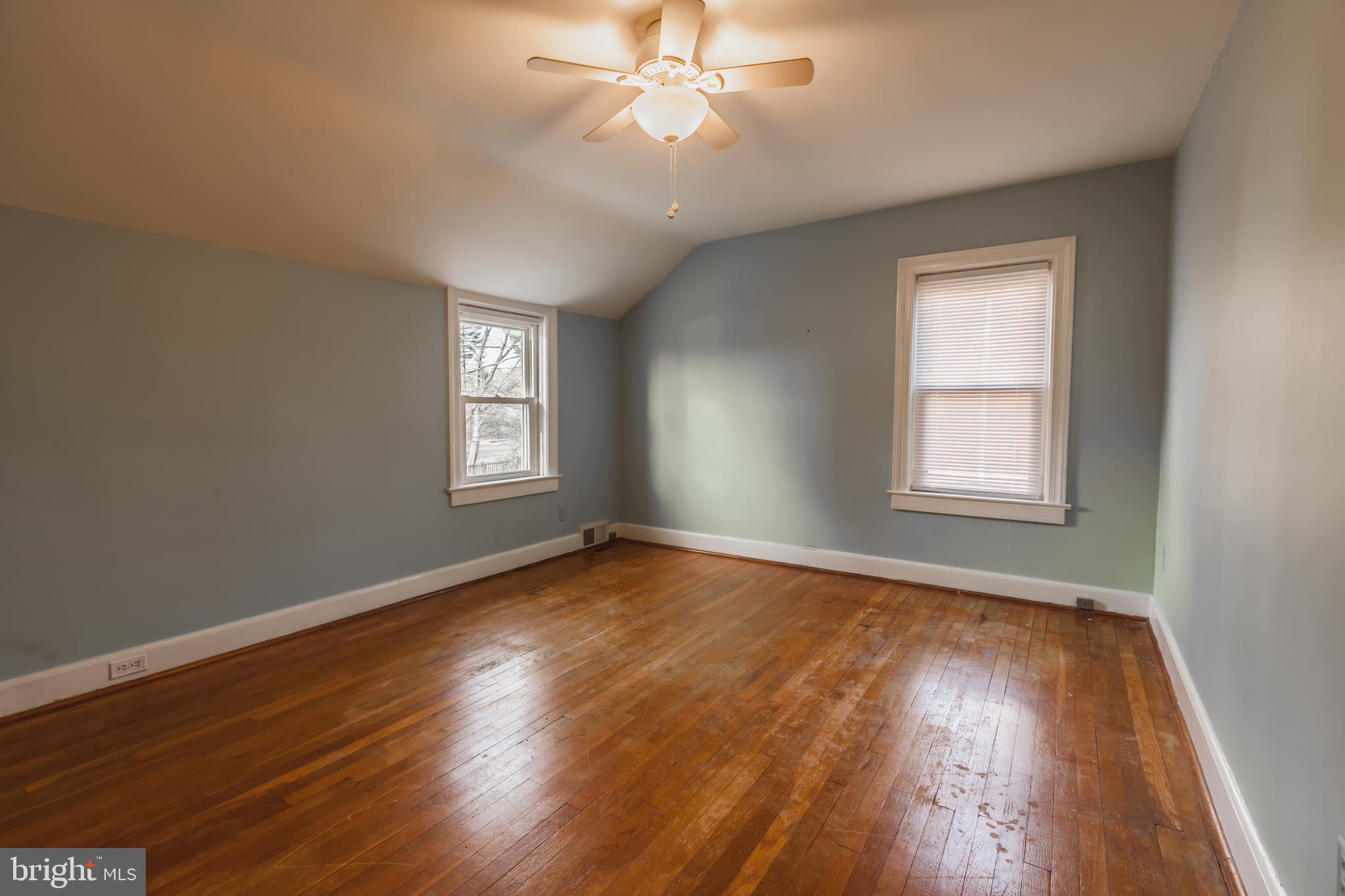 23 Sunset Road Newark, DE 19711 - Photo 17 of 25 a view of an empty room with wooden floor and a window
