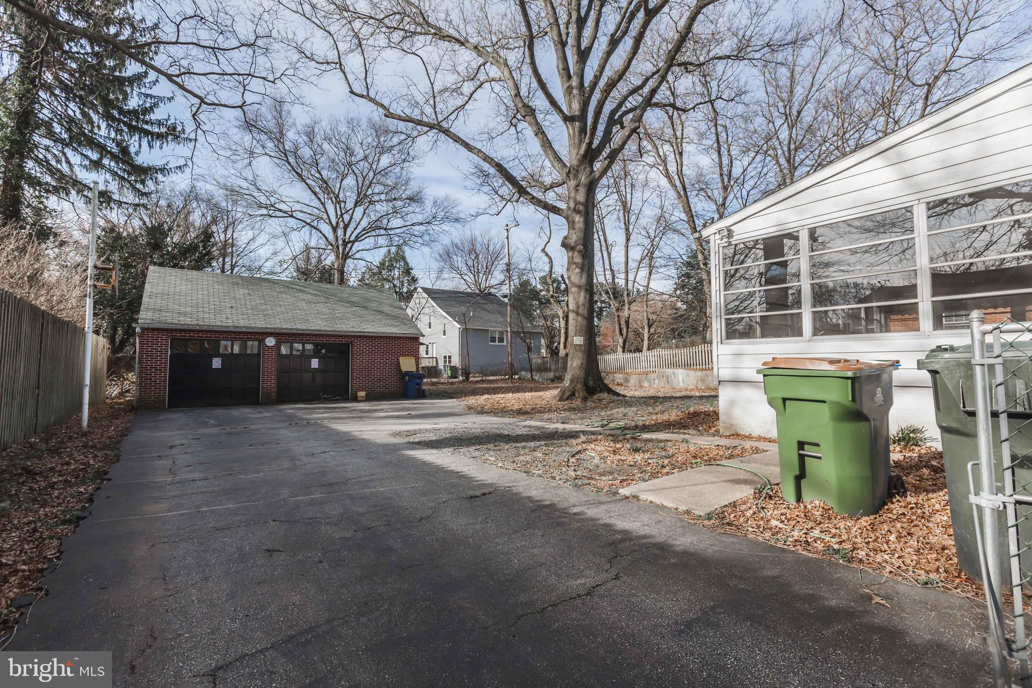 23 Sunset Road Newark, DE 19711 - Photo 22 of 25 a front view of a house with a garden and trees