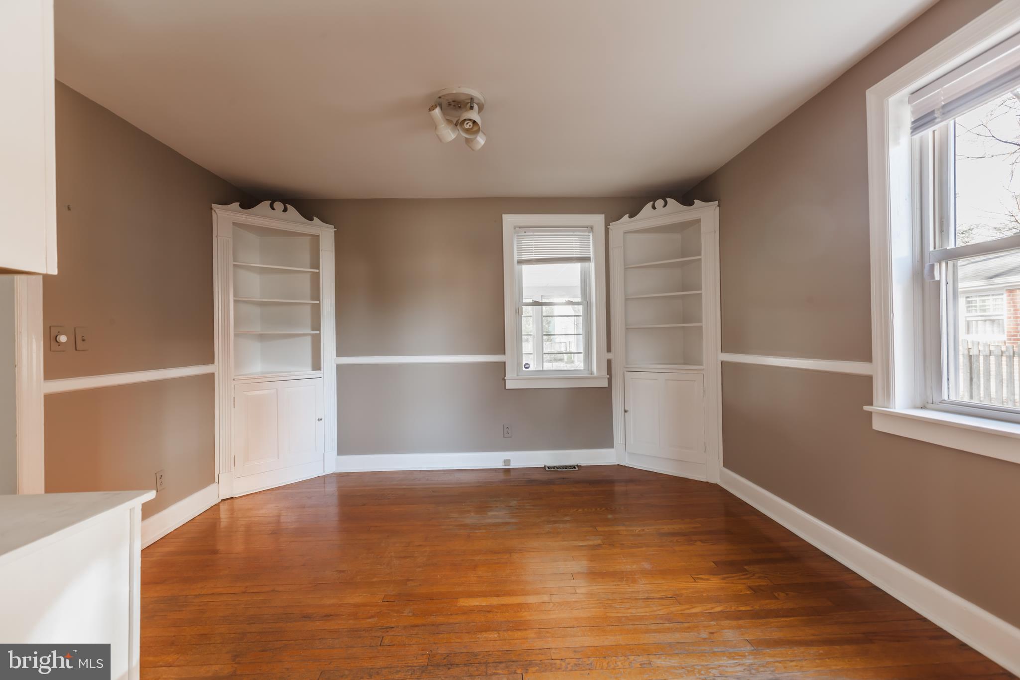 23 Sunset Road Newark, DE 19711 - Photo 4 of 25 a view of empty room with wooden floor and fan