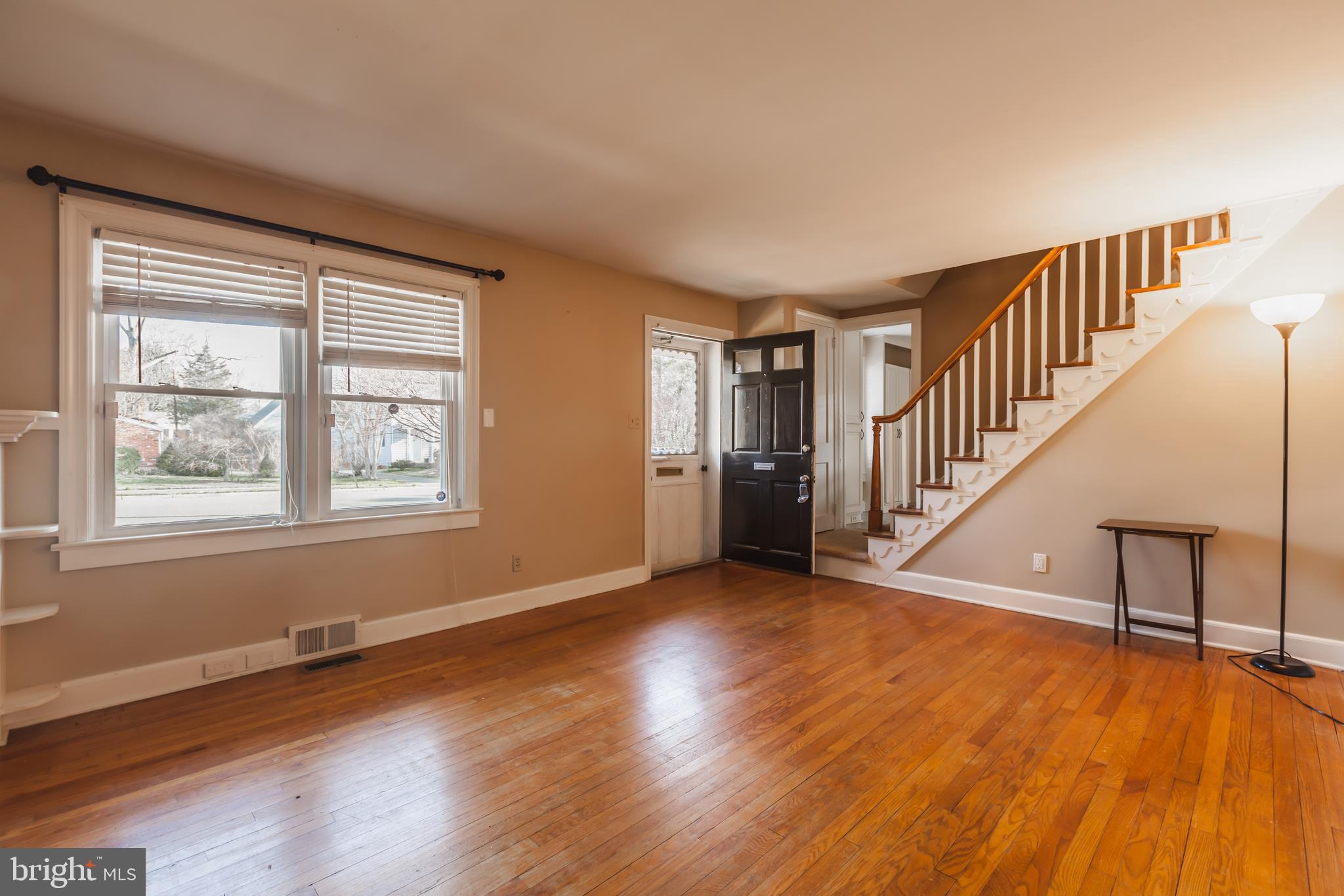 23 Sunset Road Newark, DE 19711 - Photo 5 of 25 a view of an empty room with wooden floor and a window