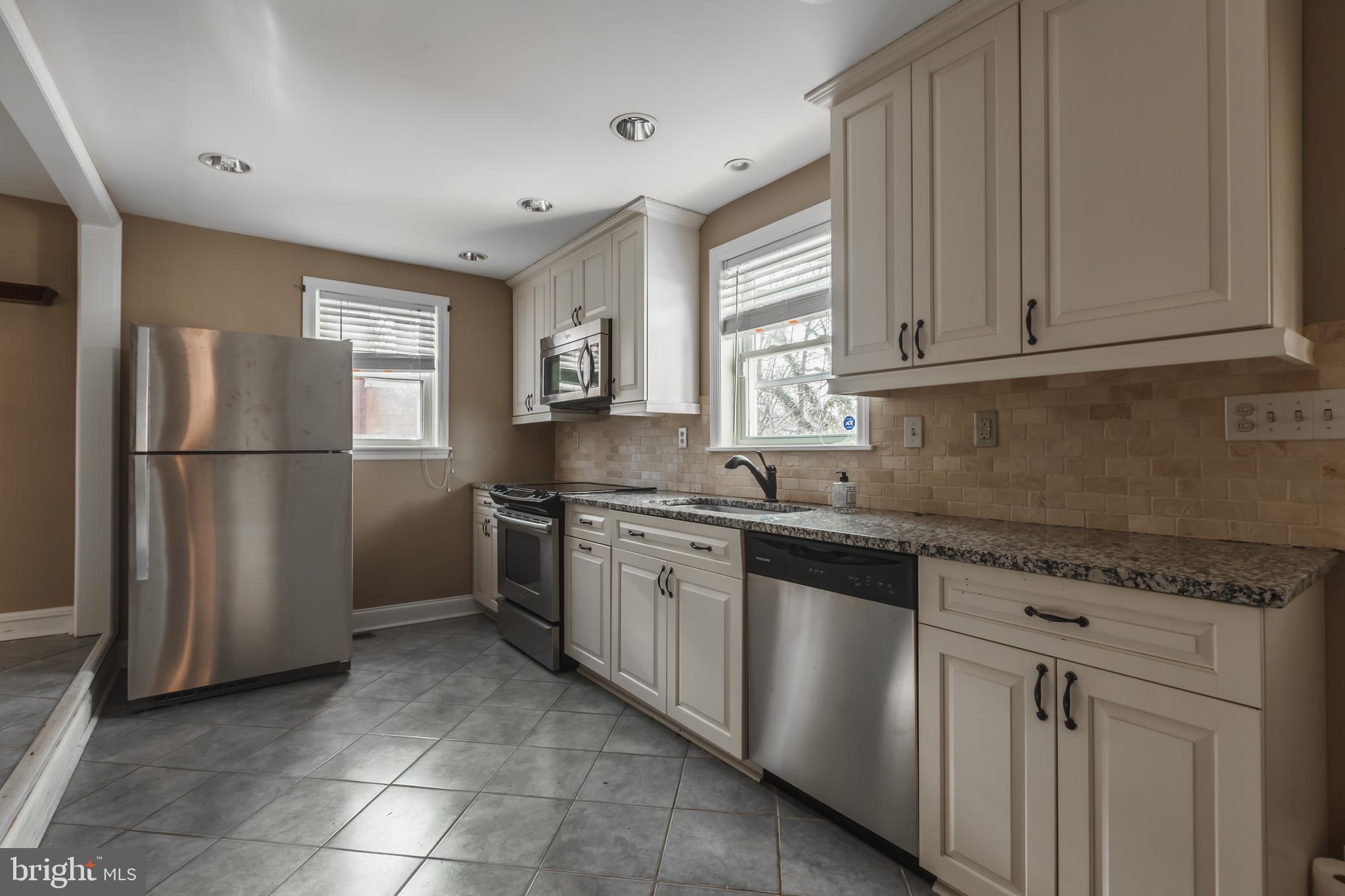 23 Sunset Road Newark, DE 19711 - Photo 8 of 25 a kitchen with stainless steel appliances granite countertop a refrigerator sink and cabinets